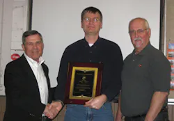 Ron Helson, HCF Executive Director (left), presents the Hart Innovative Achievement Award to We Energies, represented by Todd Go Ron Helson, HCF Executive Director (left), presents the Hart Innovative Achievement Award to We Energies, represented by Todd Go
