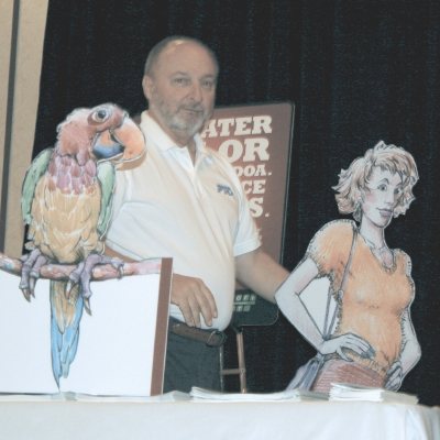 PTO Executive Director Mike Bryant poses with Pretty Polly and Sweet Sue - two characters from PTO's Profinet brochure.