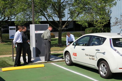 ABB's DC fast charger for electric vehicles 'tops-off' an EV at ABB&rsquo;s office and production site in the industrial park in New Berlin, Wisc.