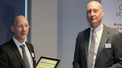 Balluff’s Jürgen Gutekunst (left) receives a certificate from John Browett, general manager of the CLPA in Europe.