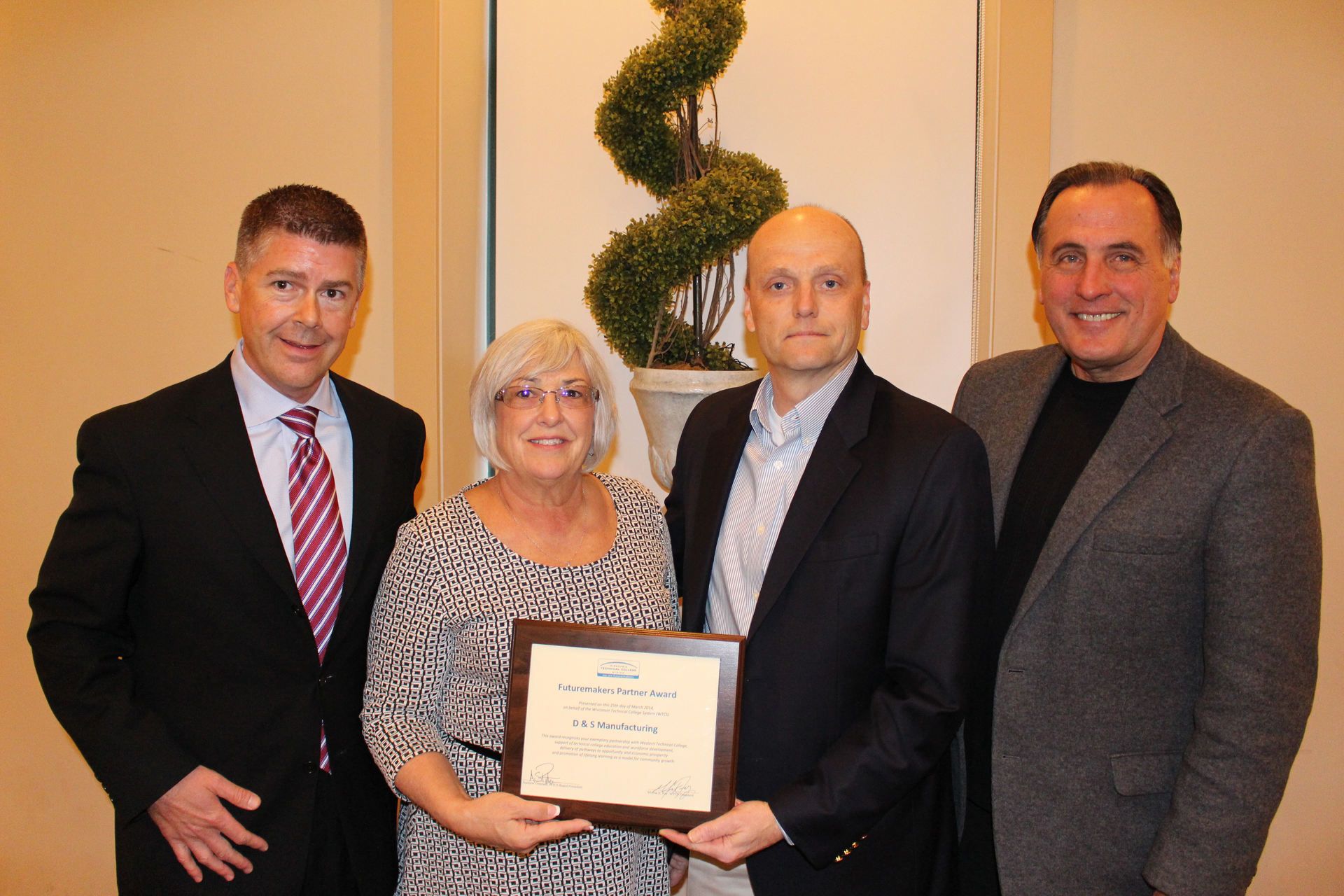 From left, WTCS Board President Drew Petersen; D & S Human Resources Manager Sherrie Hein; D&S Manufacturing Vice President and General Manager John Barkley; and Lee Rasch, president of Western Technical College.