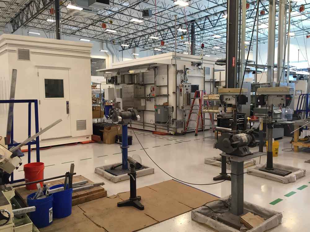 Orange pads positioned beneath the analytical equipment shelters can be pumped with air to let the buildings skate easily across the floor.