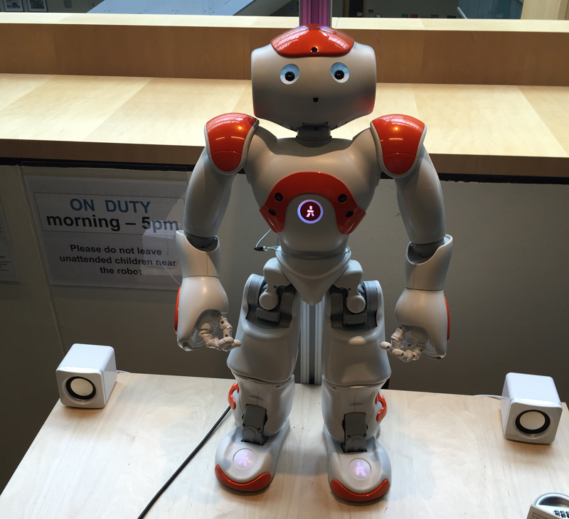 A robot stands at the ready to direct visitors to where they want to go on Microsoft's campus.