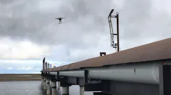 A drone flies over in-service flare stacks, identifying corrosion and marking the locations for maintenance.