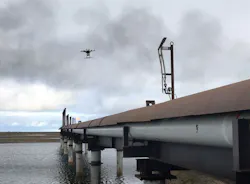 A drone flies over in-service flare stacks, identifying corrosion and marking the locations for maintenance. A drone flies over in-service flare stacks, identifying corrosion and marking the locations for maintenance.
