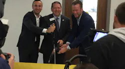 Jon DeSouza, Troy Hammond and Philip Harting (left to right) cut the ribbon at the dedication of the Harting Electronics Lab at North Central College in Naperville, Ill.