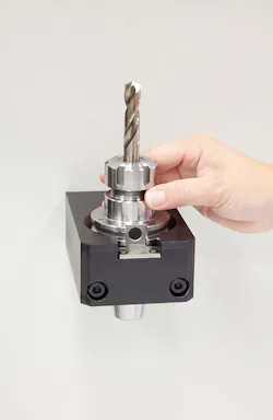 A CNC operator on the shop floor puts the tool’s holder in an RFID read station and then the tag is read by the ToolConnect system. A CNC operator on the shop floor puts the tool’s holder in an RFID read station and then the tag is read by the ToolConnect system.
