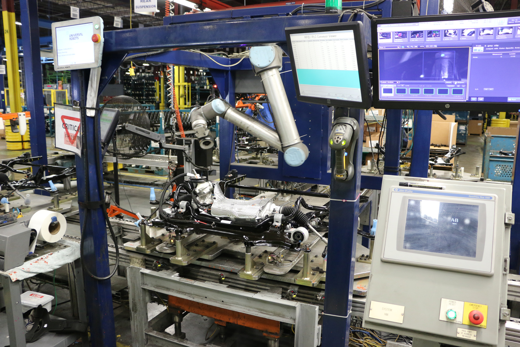The inspection system includes a UR10 cobot and a Keyence CA-HX200C LumiTrax vision system.