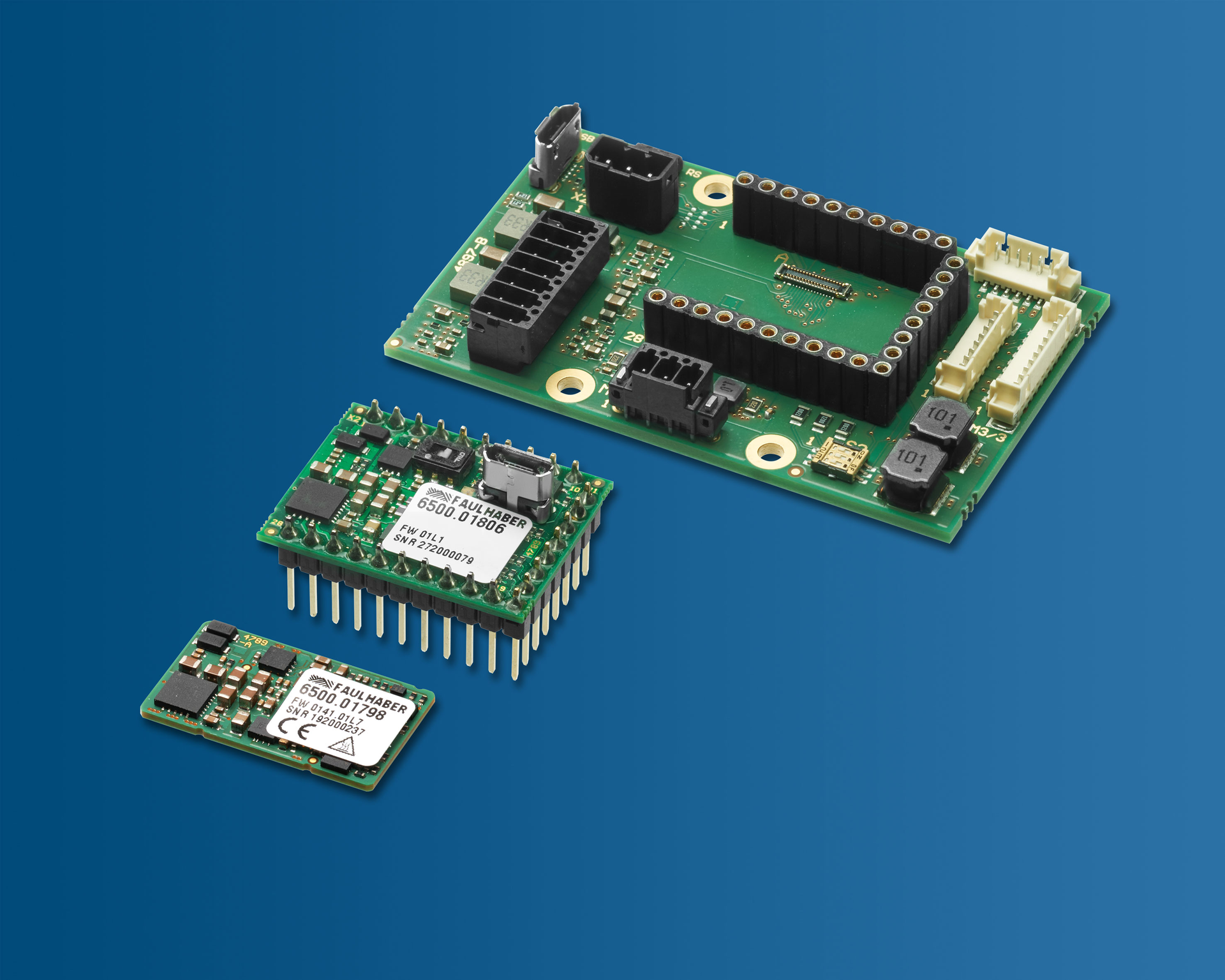 FAULHABER releases two new motion controllers: MC 3001 B (foreground) and MC 3001 P (middle). What they have in common is the extreme miniaturization. Shown in the background is a matching motherboard from the starter kit. &copy; FAULHABER