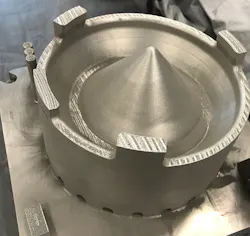 Additively manufactured cobalt-chrome sump cover for F110 jet engine. Source: GE Additive Additively manufactured cobalt-chrome sump cover for F110 jet engine. Source: GE Additive