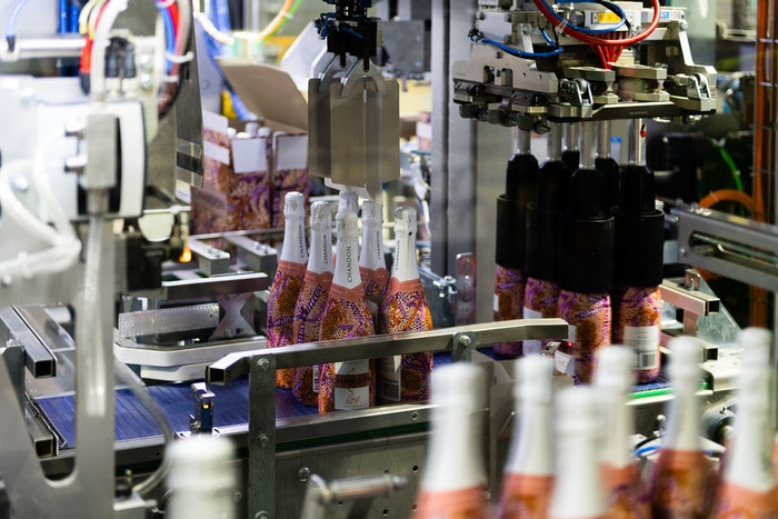 Smooth handling of bottles and partitions at Chandon is a hallmark of the end-of-line Wrap-Around case packer.