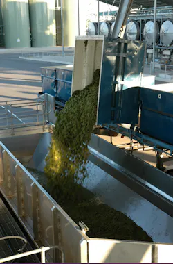 Grapes enter a hopper/crusher bay at the winery. Source: Rockwell Automation Grapes enter a hopper/crusher bay at the winery. Source: Rockwell Automation