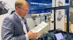 Enrico Krog Iversen, CEO of OnRobot, demonstrates the D:Ploy system at IMTS 2022.