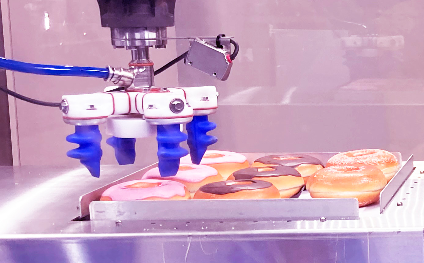 At PACK EXPO International, Soft Robotics demonstrates the picking, sorting by variety, and pack out of doughnuts at rates of up to 70 picks per minute.