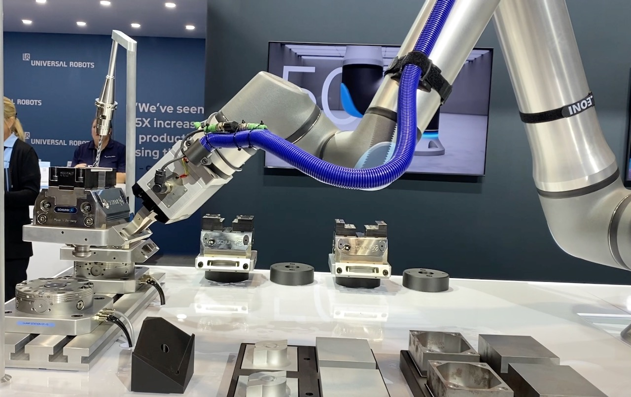 Universal Robots' UR20 demonstrating machine tending capabilities at IMTS 2022.