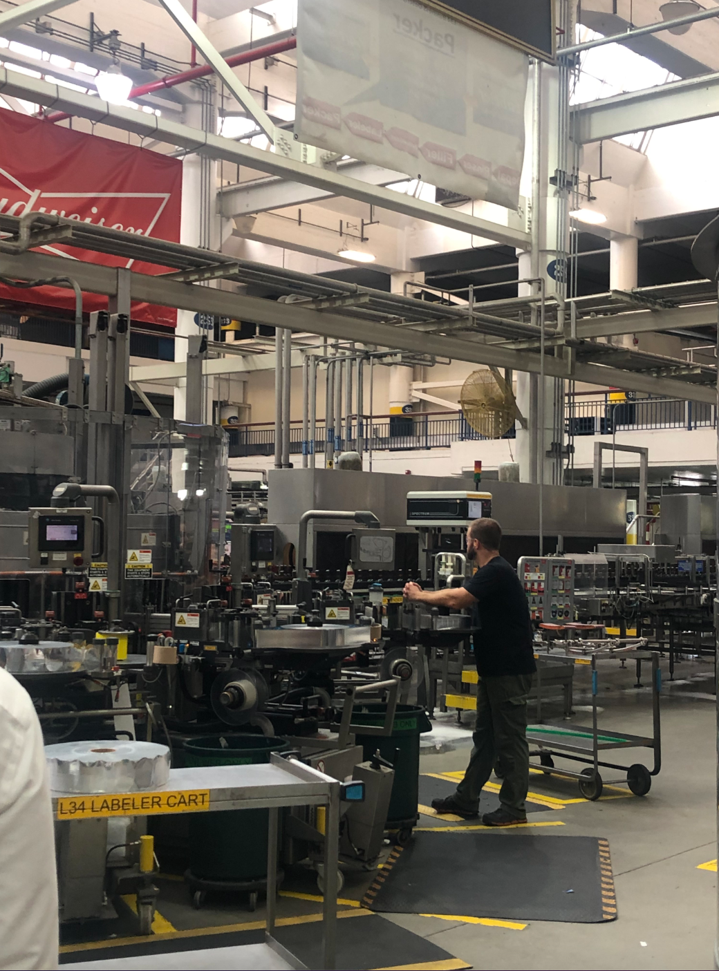 Workers monitor the packaging line at Anheuser-Busch&rsquo;s facility in St. Louis.