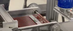 Printed labels being positioned for picking and application. Printed labels being positioned for picking and application.