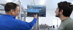 Rick Schilling, owner of IPSi, and Justin Garcia, compliance manager at SunMed Growers, review data on the automated labeling system's HMI. Rick Schilling, owner of IPSi, and Justin Garcia, compliance manager at SunMed Growers, review data on the automated labeling system's HMI.