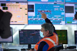 Veolia employee monitors screens in a project control center. Veolia employee monitors screens in a project control center.