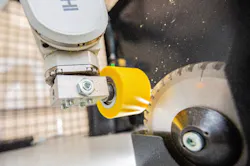 Close-up shot of the Mitsubishi robot arm positioning a rubber part for grinding. Source: Frauenhofer Institute Close-up shot of the Mitsubishi robot arm positioning a rubber part for grinding. Source: Frauenhofer Institute