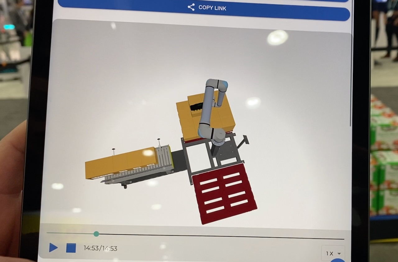 Reviewing the digital twin in Columbia/Okura's miniPal palletizing system on a mobile device.