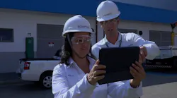 Sheila de Oliveira, production manager at Aquapolo, and a co-worker review wastewater treatment plant operations data. Source: Aveva