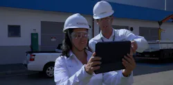 Sheila de Oliveira, production manager at Aquapolo, and a co-worker review wastewater treatment plant operations data. Source: Aveva Sheila de Oliveira, production manager at Aquapolo, and a co-worker review wastewater treatment plant operations data. Source: Aveva