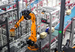 Mujin robot in package processing warehouse application. Mujin robot in package processing warehouse application.