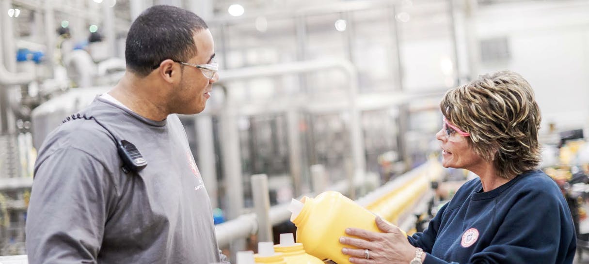 Plant floor workers in a Church & Dwight production facility.