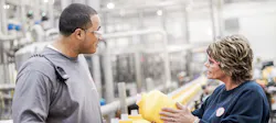 Plant floor workers in a Church & Dwight production facility. Plant floor workers in a Church & Dwight production facility.