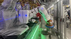 A KUKA Agilus robot outfitted with Airskin’s collaborative robot technology in the seat measurement work cell at BMW Regensburg.