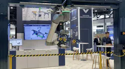 A gantry robot workcell designed and built with Vention components and featuring a UR cobot in Vention's Automate 2024 exhibit.