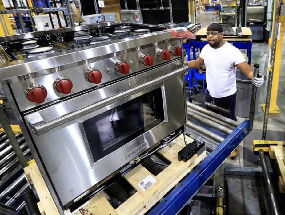 A Wolf range from Sub-Zero moving through the assembly process.