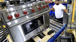 A Wolf range from Sub-Zero moving through the assembly process.