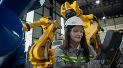 Engineer reviewing robotic workcell
