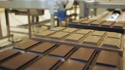 Chocolate bars from Barry Callebaut move along a conveyor belt