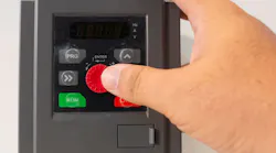 Close-up of a hand adjusting settings on an inverter variable speed drive