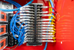 a detailed close-up view of colorful electrical wiring inside a control panel a detailed close-up view of colorful electrical wiring inside a control panel