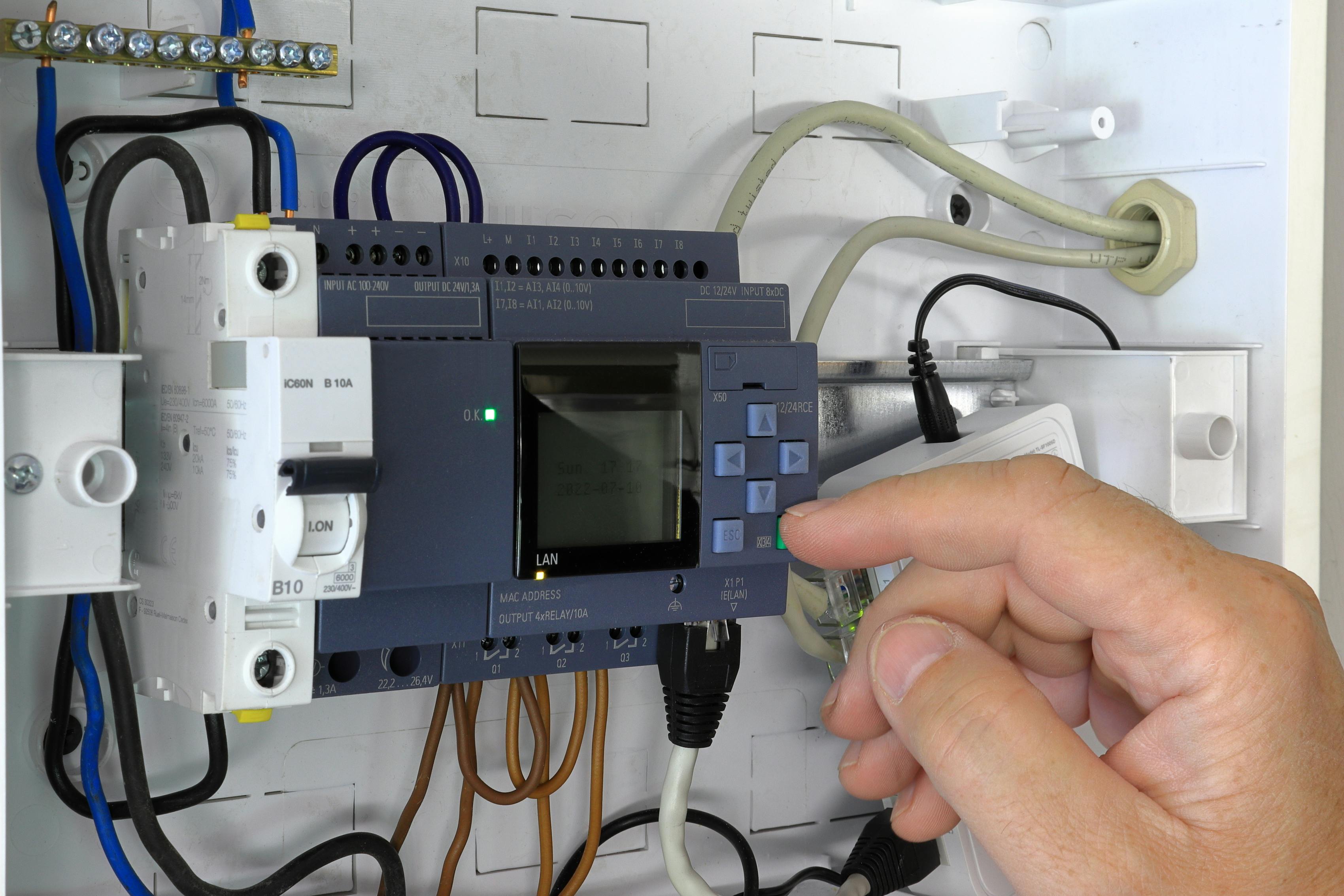 programming a PLC in a panel