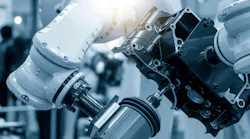 The automotive parts finishing process by milling spindle attached the robotics arm. The hi-technology automotive parts manufacturing process by robotics system.
