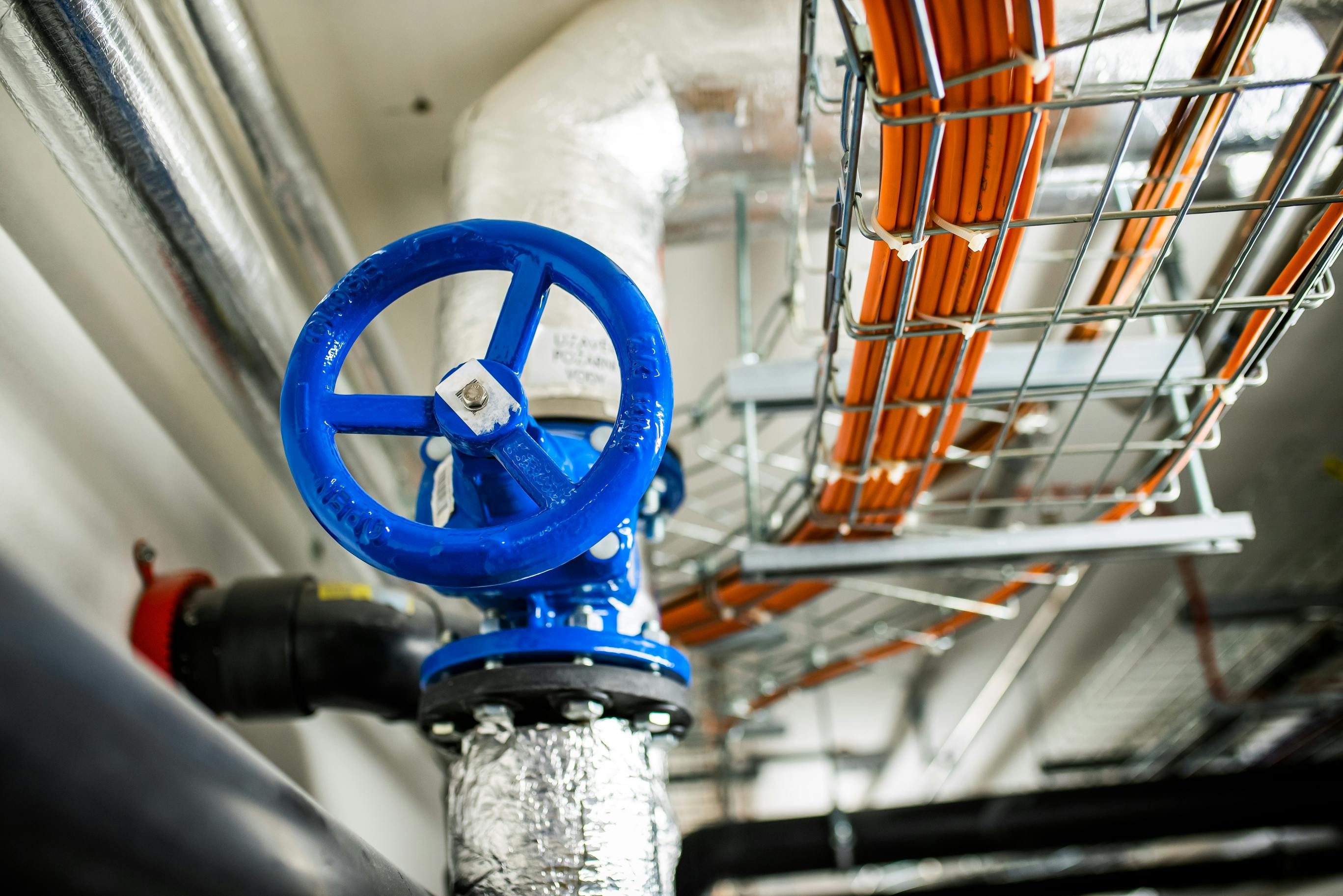 Water shutoff valve near industrial networking cables