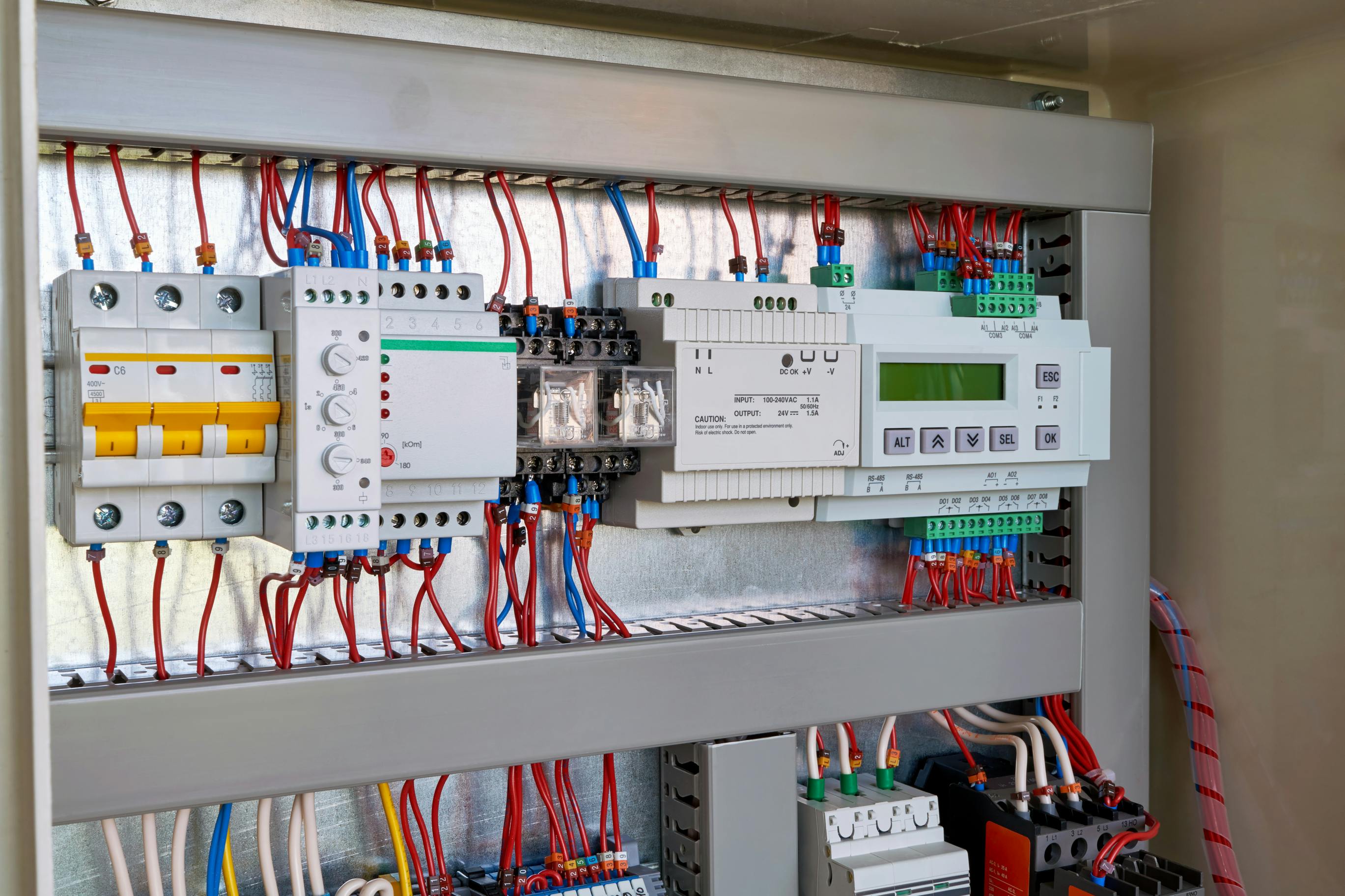 Controller, power supply, phase control relay, circuit breaker in a electrical/control cabinet.