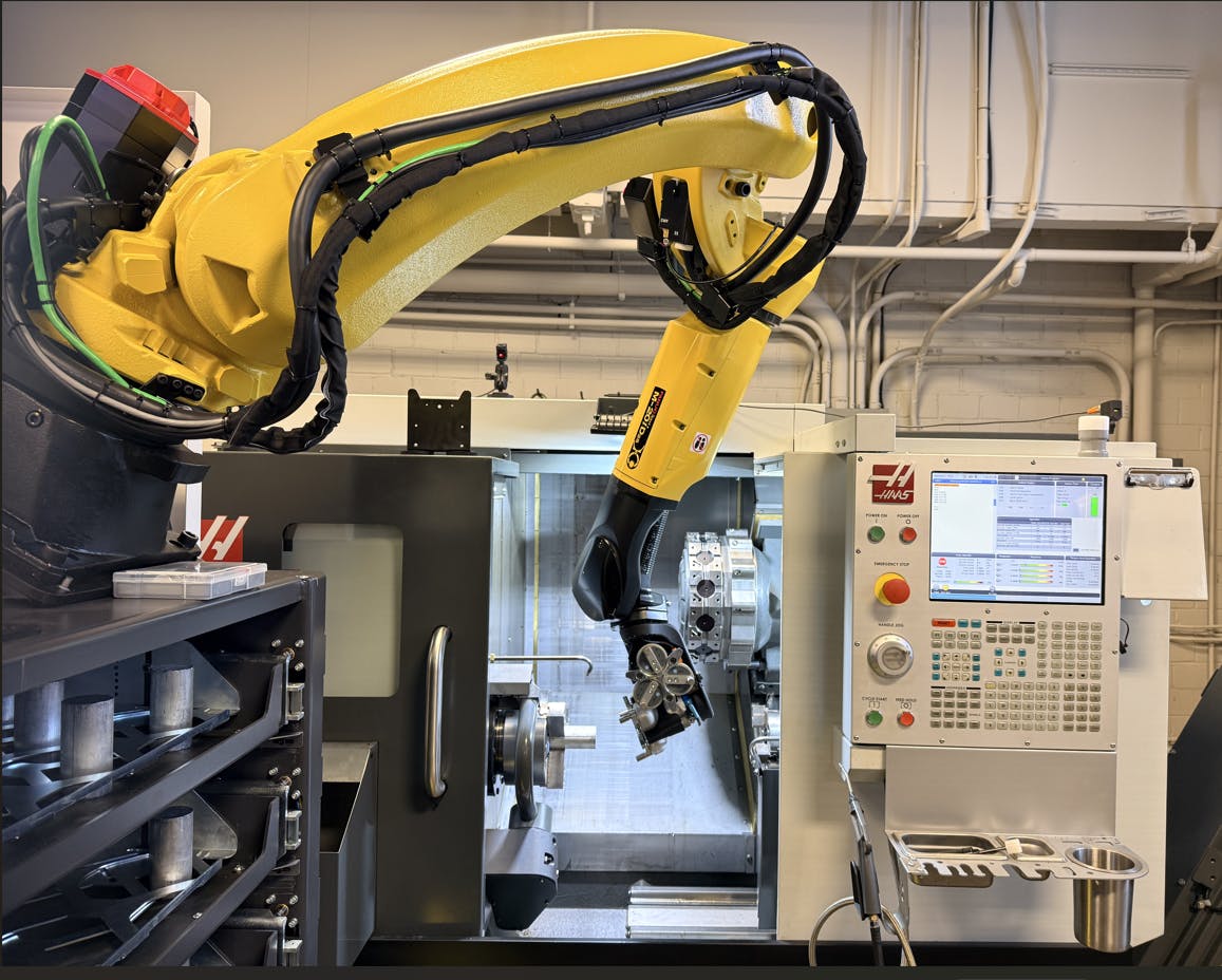 robot performing machine tending