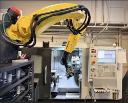 robot performing machine tending