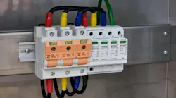 Photo of switch fuse and surge protection device connection in electrical cabinet. Photo of switch fuse and surge protection device connection in electrical cabinet.