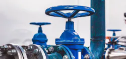 A close-up view of a shut-off valve inside a water pumping station. The setting highlights engineering communications and industrial design, showcasing the functioning components of the system. A close-up view of a shut-off valve inside a water pumping station. The setting highlights engineering communications and industrial design, showcasing the functioning components of the system.