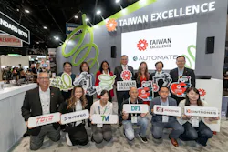 Members from Taiwanese Excellence award-winning companies at the Taiwan Excellence Pavilion during the 2026 Automate show pose together holding up their company signs.