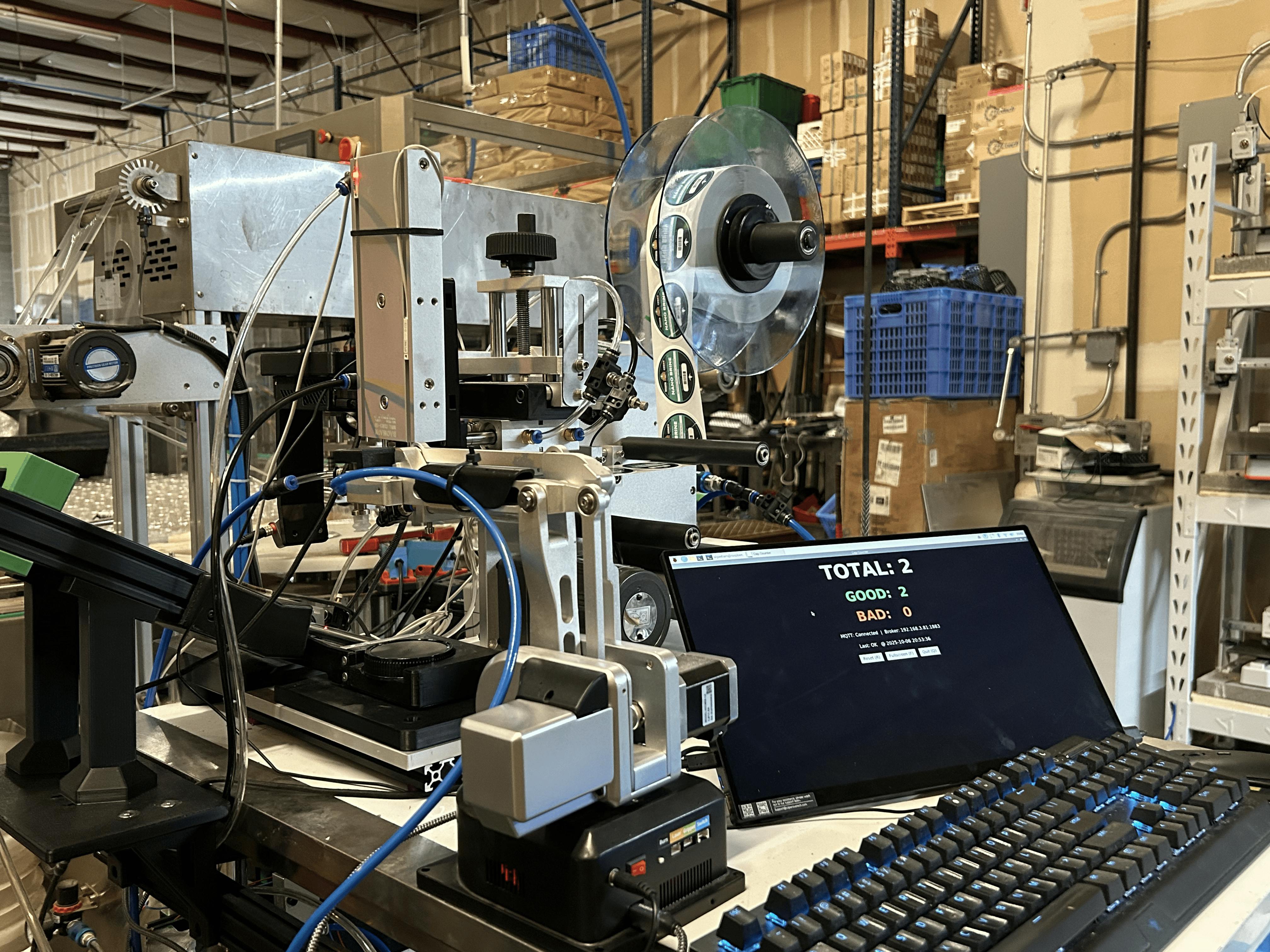 AlgaeBarn built a $1,000 automated cap labeling cell combining robotics, machine vision and controls to improve quality, uptime and productivity.
