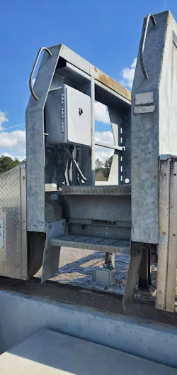 Figure 2: The control cabinet is shown mounted to the bridge arm. Since the bridge must rotate continuously on the center axis, the controller needed to be mounted directly onto it.